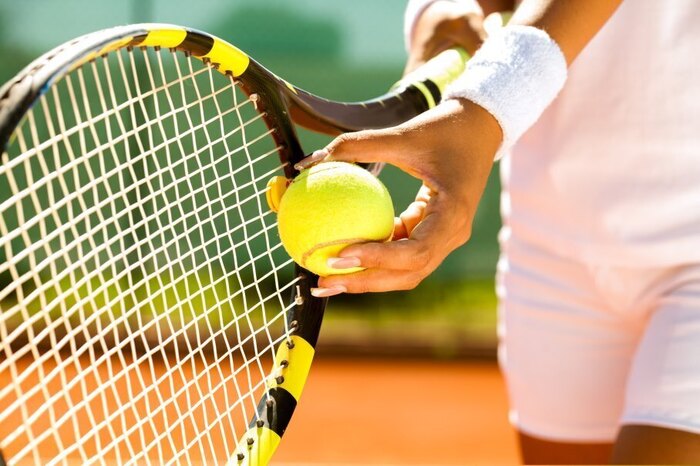 A tennis player about to serve 